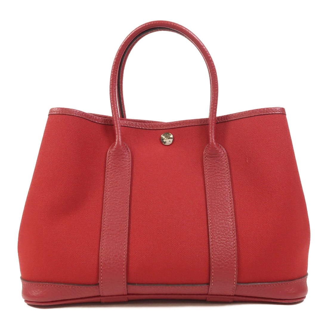 Hermes Garden Party TPM Red Canvas Tote with Palladium Hardware: Hermes Garden Party TPM Red Canvas Tote with Palladium Hardware This Hermes Garden Party TPM tote bag features a durable red canvas exterior with palladium hardware. Designed for women, this stylish a
