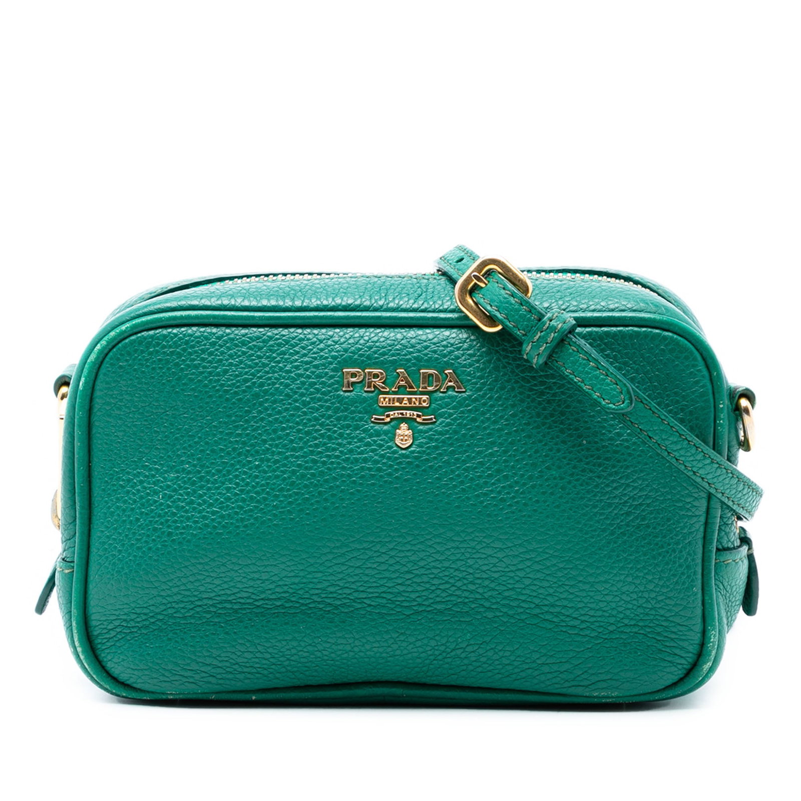Green Leather Crossbody Mini Camera Bag by Prada Vitello Daino: Green Leather Crossbody Mini Camera Bag by Prada Vitello Daino This Prada Mini Vitello Daino Camera Bag is crafted from green leather and features a compact crossbody design. It includes an adjustable