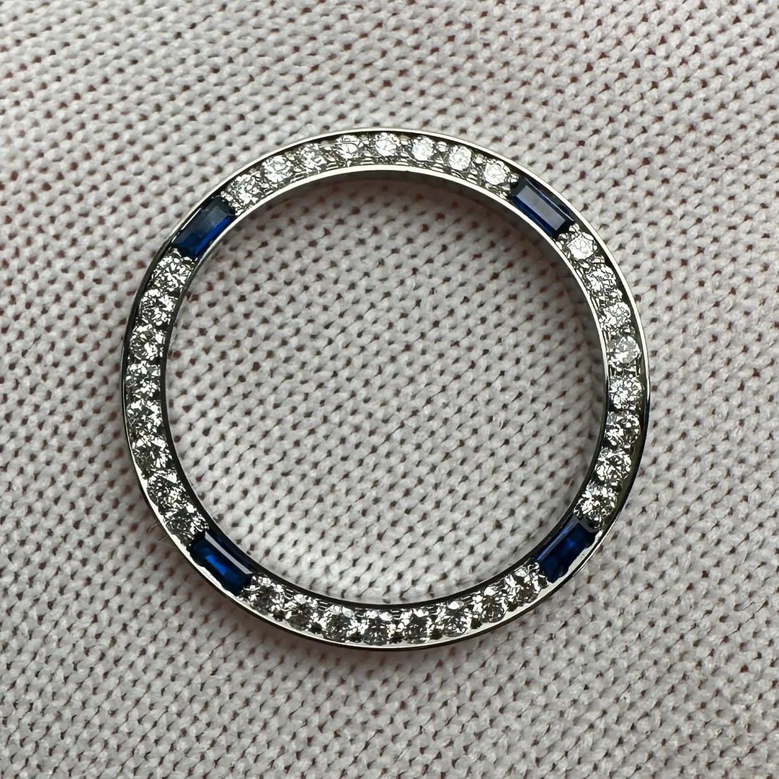 Stainless Steel Bezel for Datejust 26mm with .64ct Diamonds and Blue Sapphires: Stainless Steel Bezel for Datejust 26mm with .64ct Diamonds and Blue Sapphires This is a custom luxury bezel made of stainless steel, designed for Rolex Datejust 26mm models. The bezel is set with 0.6