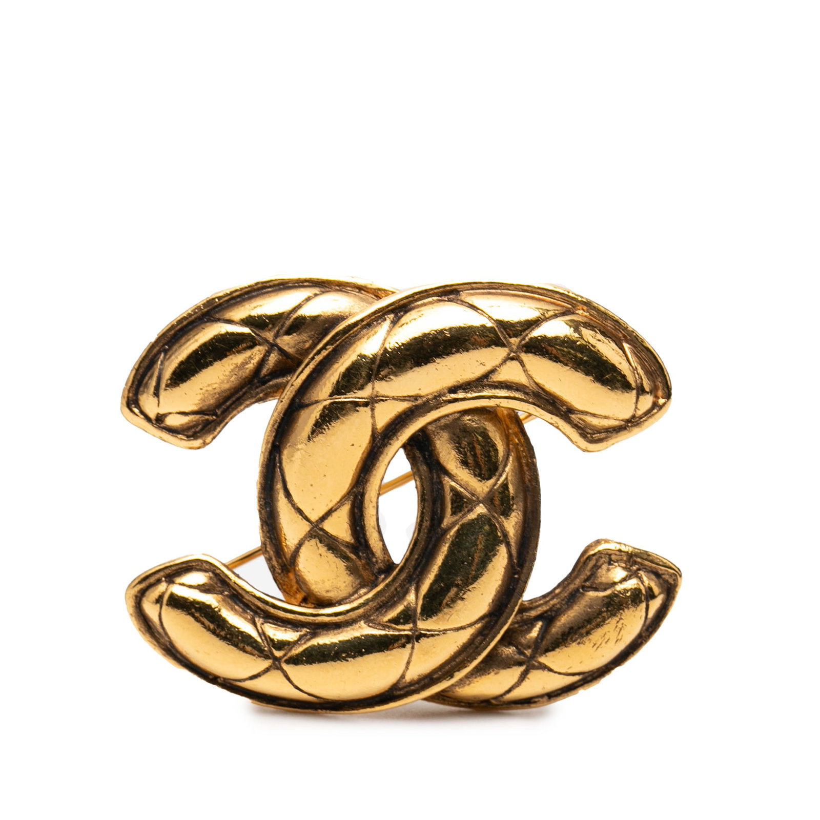 Chanel Quilted CC Brooch Gold Tone Metal Pin: Chanel Quilted CC Brooch Gold Tone Metal Pin This Chanel brooch features a gold-tone metal body with a quilted CC design and a back pin closure. Made in France, it is categorized as costume jewelry