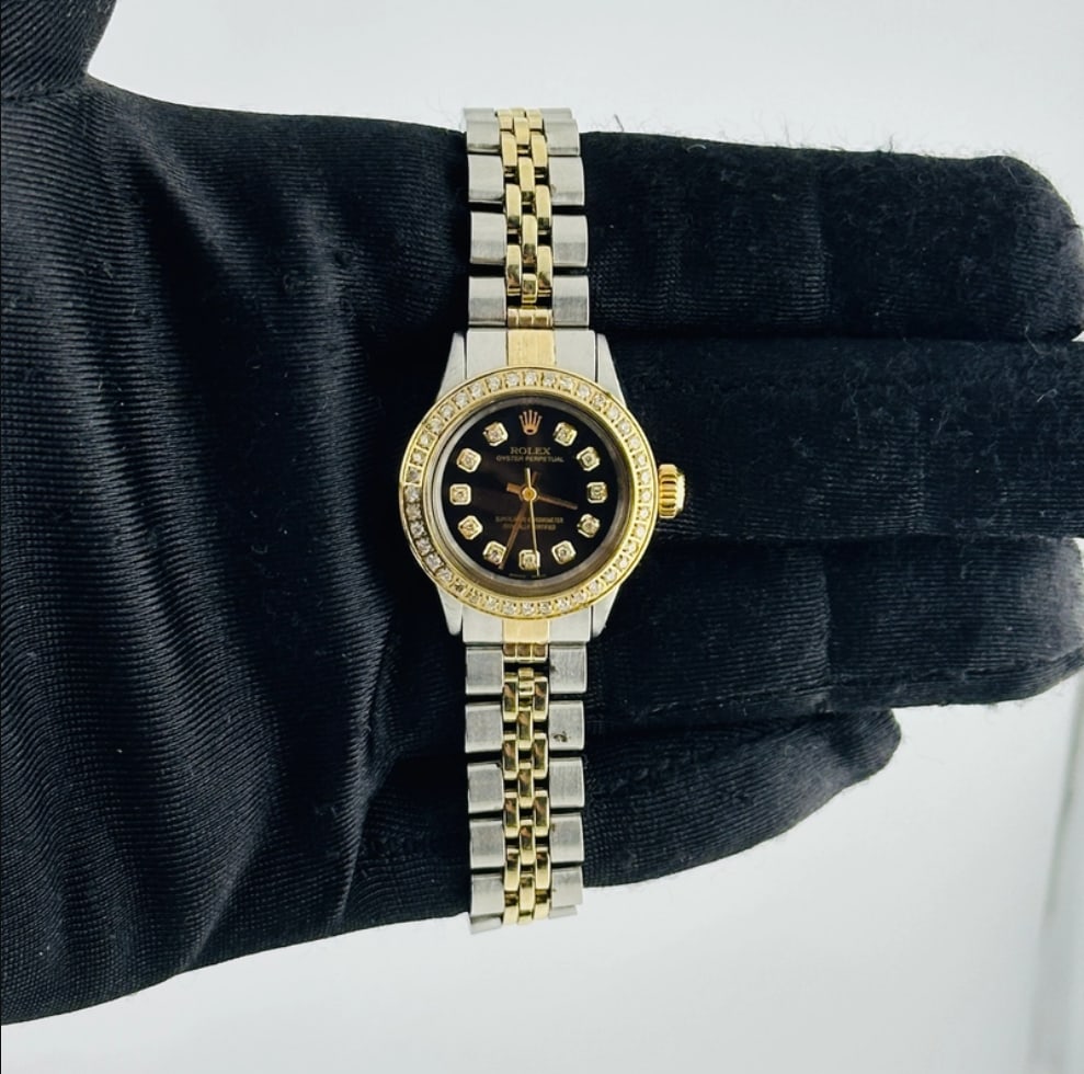 Ladies Aftermarket Black Diamond Dial Watch Ref 6619 Jubilee Bracelet: Ladies Aftermarket Black Diamond Dial Watch Ref 6619 Jubilee Bracelet This ladies Rolex Oyster Perpetual features an Aftermarket black diamond dial and an Aftermarket Jubilee bracelet. The timepiece i