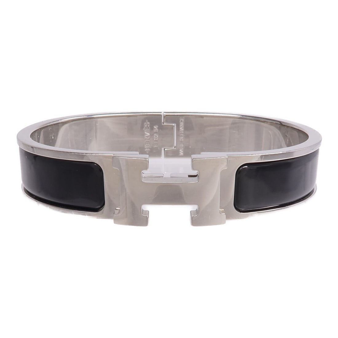 Hermes Clic H enamel bangle in black and silver: Hermes Clic H enamel bangle in black and silver This Hermes Clic H bracelet features a sleek black enamel design with silver-tone metal accents. Crafted in France, this women's bracelet is designed fo