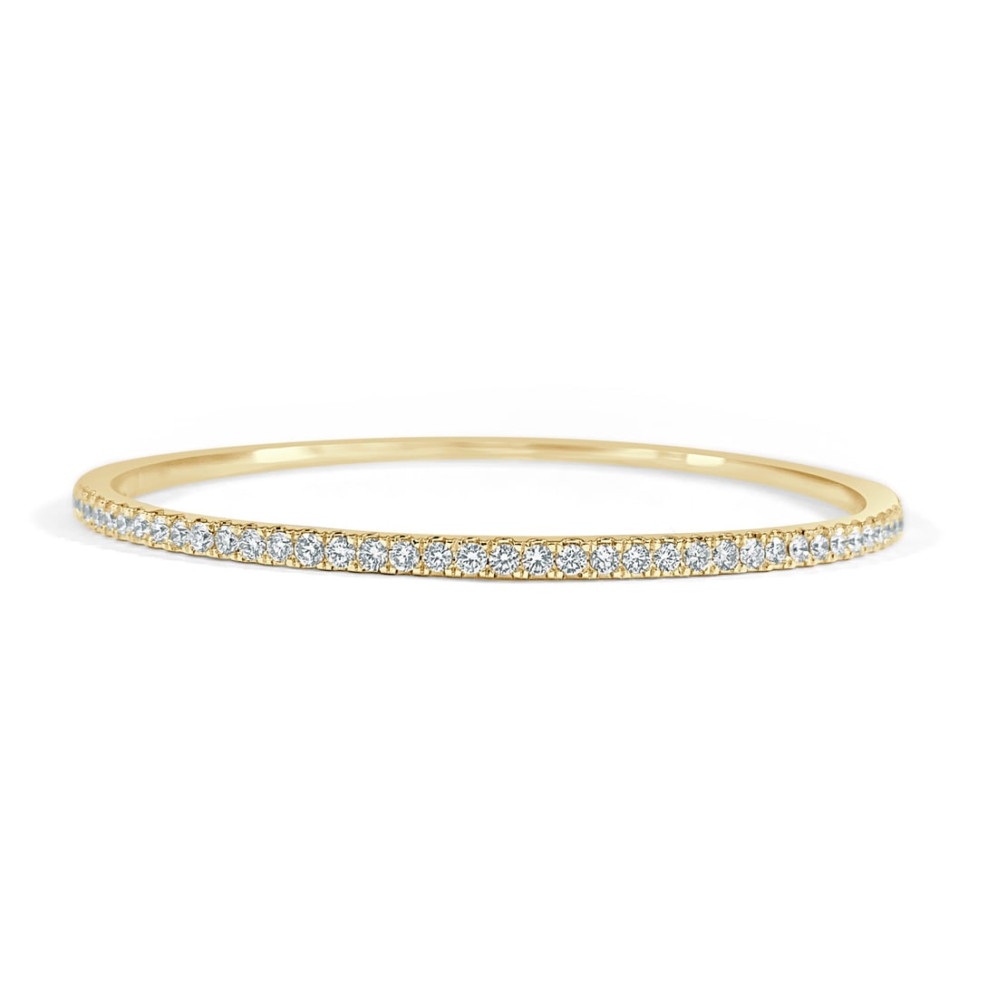 Women's 14K Yellow Gold Bangle Bracelet with 1.00 Carat Diamonds: Women's 14K Yellow Gold Bangle Bracelet with 1.00 Carat Diamonds This women's bangle features 40 diamonds with a total carat weight of 1.00, set in 14K yellow gold. The piece is pre-owned and originat