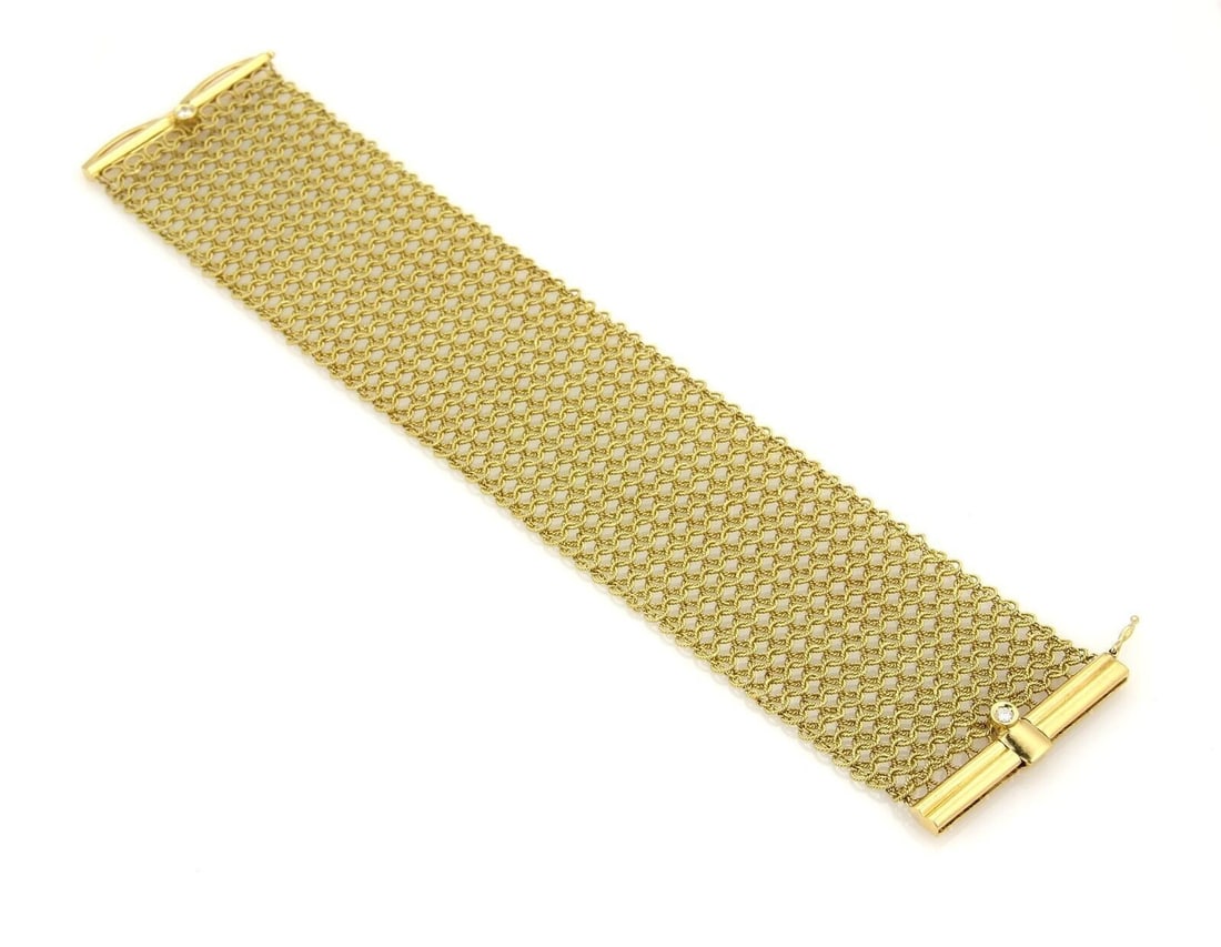 Judith Ripka 18k Yellow Gold Diamond Mesh Flex Bracelet: Judith Ripka 18k Yellow Gold Diamond Mesh Flex Bracelet This Judith Ripka bracelet is crafted from 18k yellow gold and features a wide mesh flex design accented with natural diamonds. The flexible con