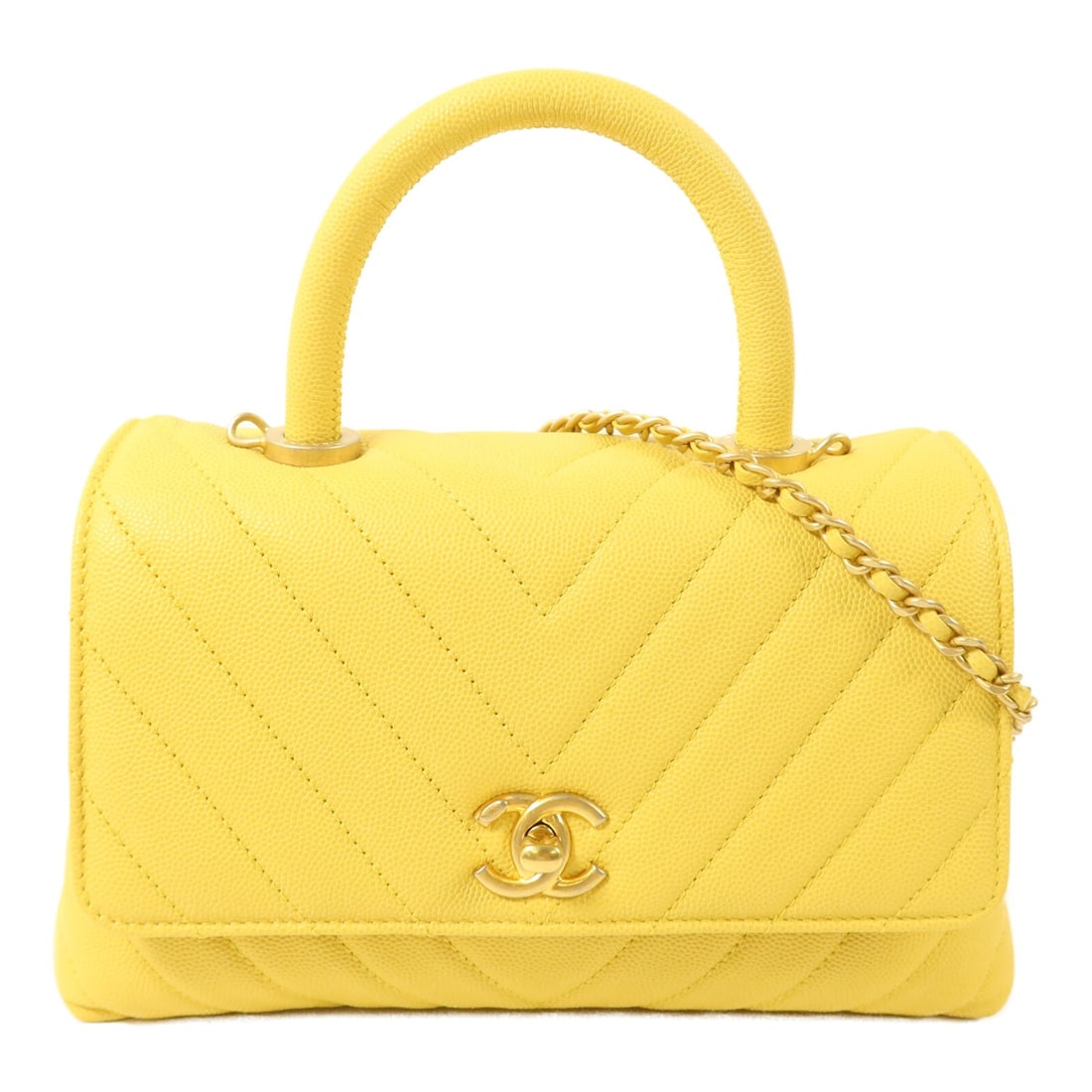 CHANEL Coco Handle Yellow Calfskin 2 Way Shoulder Bag: CHANEL Coco Handle Yellow Calfskin 2 Way Shoulder Bag This CHANEL CC Coco Handle Small 2 Way Shoulder Bag is crafted from luxurious yellow calfskin leather. Designed for versatility, it can be carried