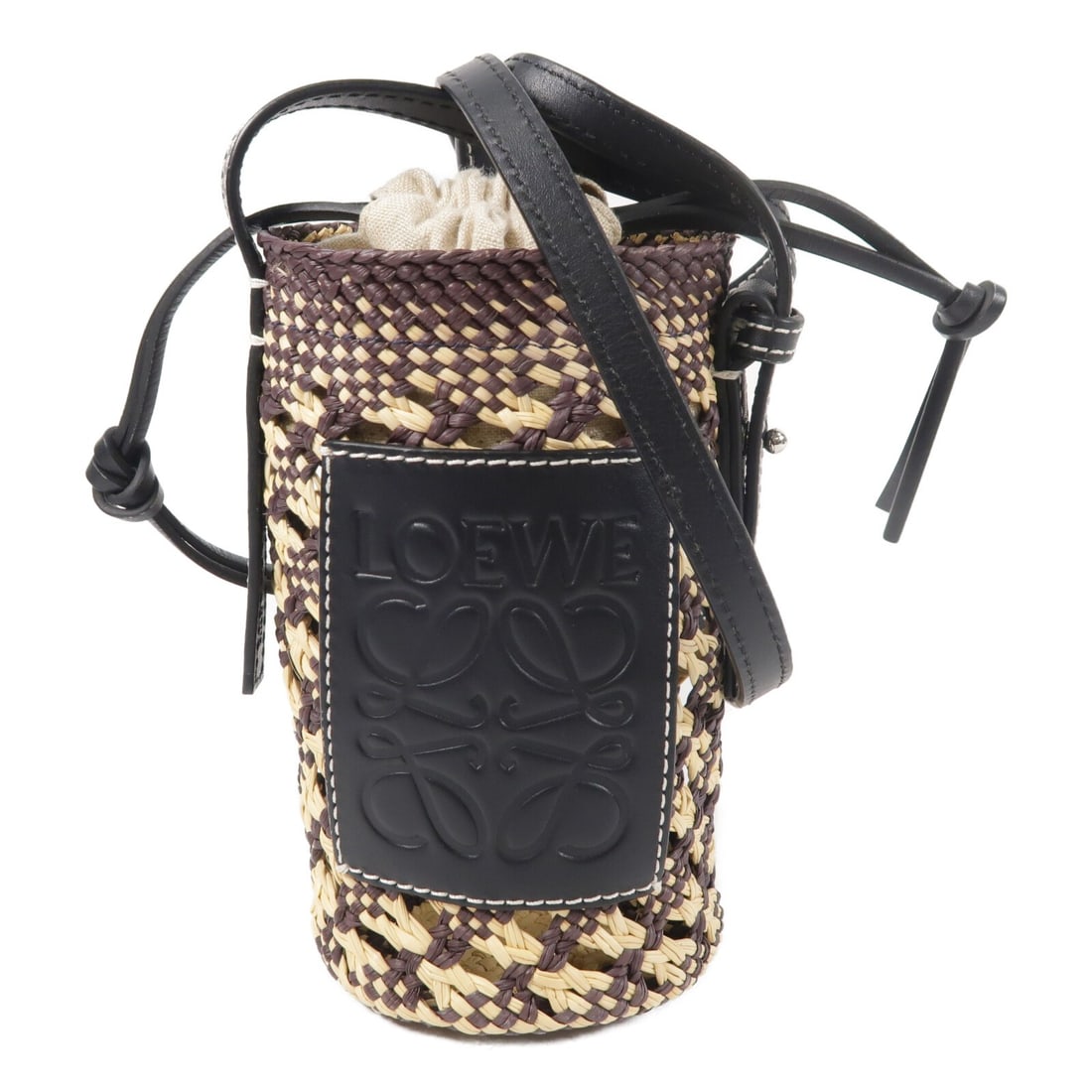 Loewe Black Cylinder Pocket Shoulder Bag in Raffia and Calfskin Leather: Loewe Black Cylinder Pocket Shoulder Bag in Raffia and Calfskin Leather This LOEWE Cylinder Pocket shoulder bag is crafted from black calfskin leather and features a compact, cylindrical shape. Design