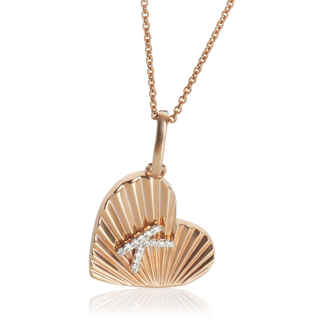 14K Rose Gold Heart Pendant with Diamond Initial K: 14K Rose Gold Heart Pendant with Diamond Initial K This exquisite pendant features a stunning heart design crafted from 14K rose gold, displaying a round brilliant diamond at its center. With a total 