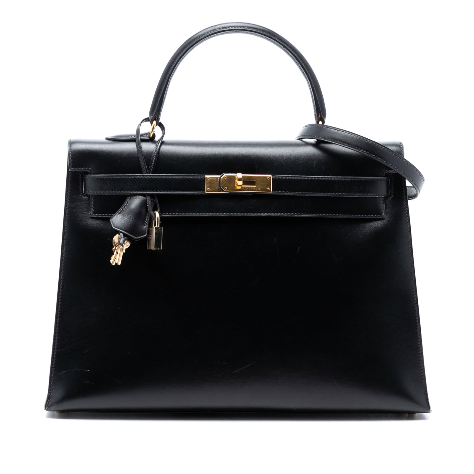 Hermes Kelly Sellier 35 Black Box Calf Leather Handbag with Shoulder Strap: Hermes Kelly Sellier 35 Black Box Calf Leather Handbag with Shoulder Strap The Hermes Kelly Sellier 35 is crafted in Noir Box Calf leather and features a rolled leather top handle, a detachable flat l
