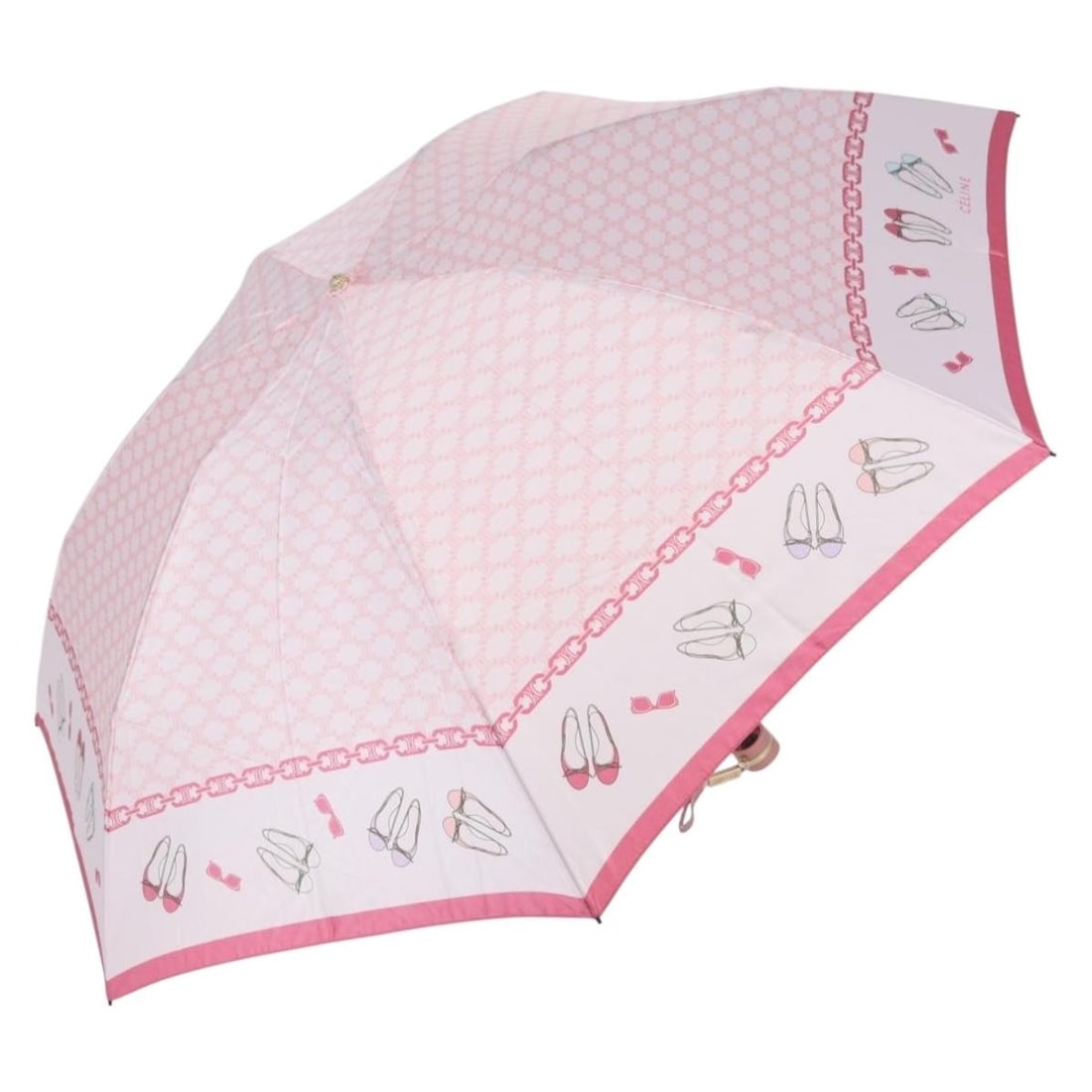 Pink Nylon Folding Umbrella with Macadam Canvas by CELINE: Pink Nylon Folding Umbrella with Macadam Canvas by CELINE This CELINE folding umbrella features a pink nylon and Macadam canvas exterior, designed for women. The umbrella has a rib length of approxima