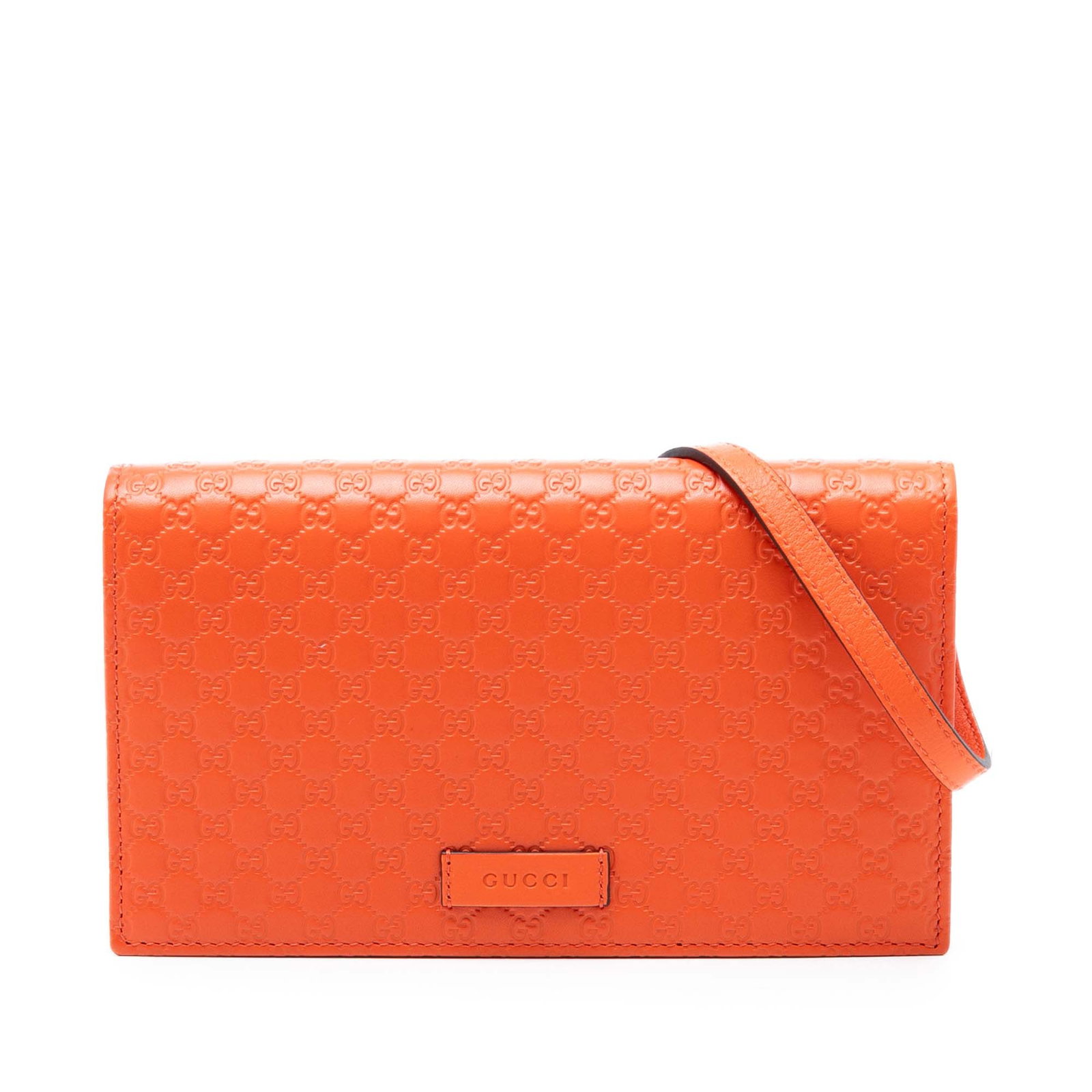 Orange Leather Crossbody Bag by Gucci Microguccissima: Orange Leather Crossbody Bag by Gucci Microguccissima The Gucci Microguccissima Wallet on Strap is a crossbody bag crafted from embossed leather in orange, featuring a flat leather strap and a flap wi