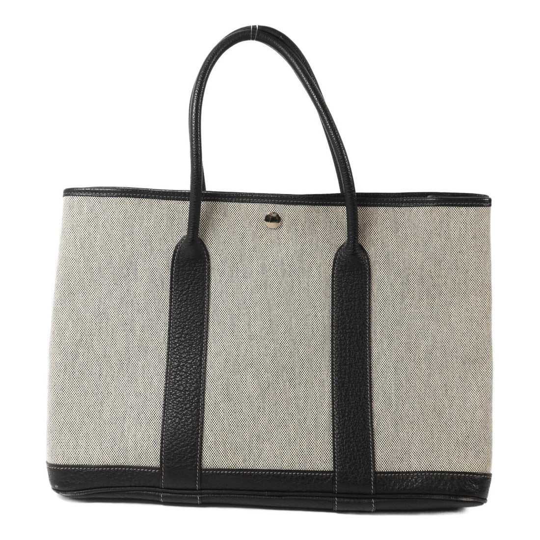 Hermes Garden Party PM canvas tote in noir and white: Hermes Garden Party PM canvas tote in noir and white This Hermes Garden Party PM handbag features a black and white canvas exterior with palladium hardware. Designed for women, it offers a classic and