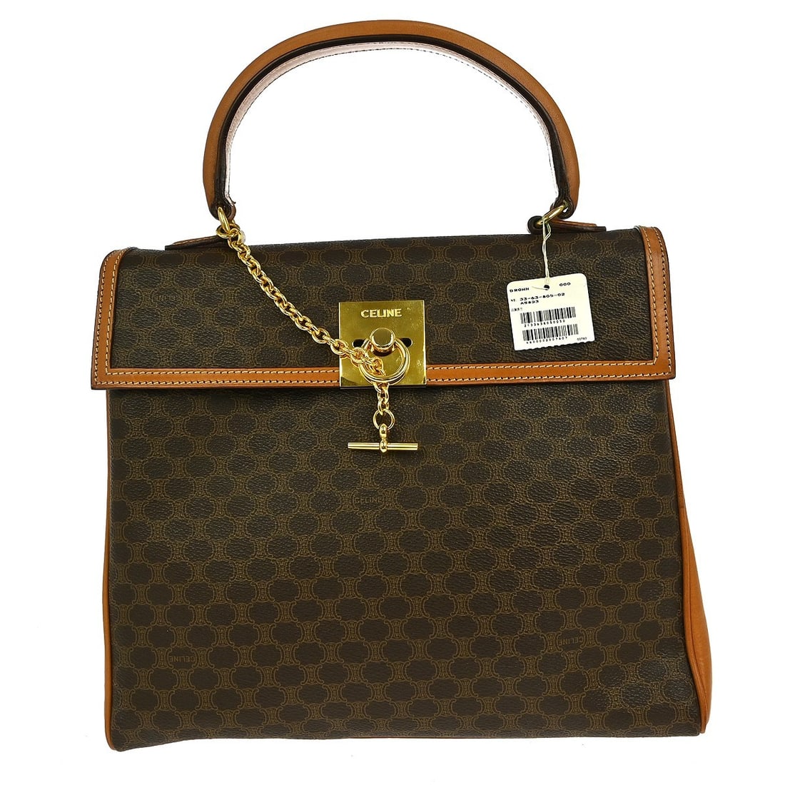 Celine Macadam Brown PVC Leather Shoulder Top Handle Bag Medium: Celine Macadam Brown PVC Leather Shoulder Top Handle Bag Medium This Celine Macadam top handle bag features a brown exterior crafted from leather and PVC, complemented by the iconic Celine logo accent