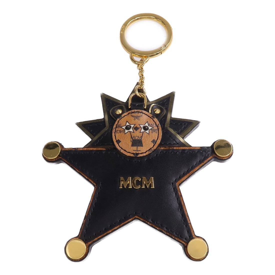 MCM black leather key ring with gold tone hardware: MCM black leather key ring with gold tone hardware This MCM key ring is crafted from black leather and designed for unisex use. It features a sleek black finish and is equipped with gold-tone hardware