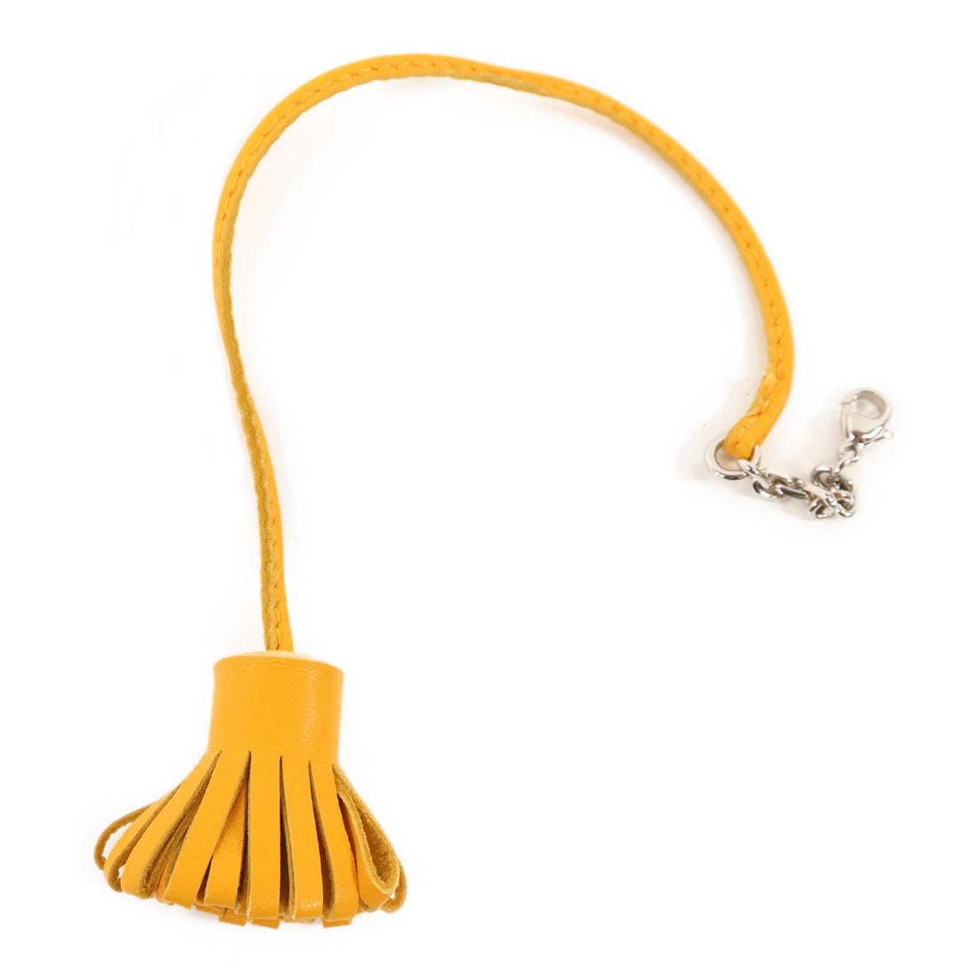 Carmencita Orange Lambskin Charm with Palladium Hardware by Hermes: Carmencita Orange Lambskin Charm with Palladium Hardware by Hermes This Hermes Carmencita Pagemarker charm is crafted from orange Milo lambskin leather. Designed for women, it can be used as a stylish