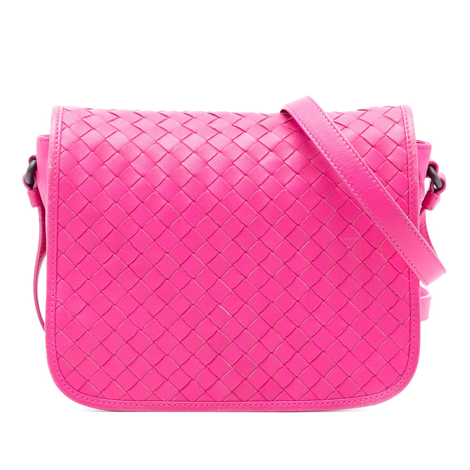 Pink Leather Crossbody Bag by Bottega Veneta Nappa Intrecciato: Pink Leather Crossbody Bag by Bottega Veneta Nappa Intrecciato This Bottega Veneta Nappa Intrecciato Flap Crossbody bag showcases a woven leather exterior in pink with an adjustable flat leather strap