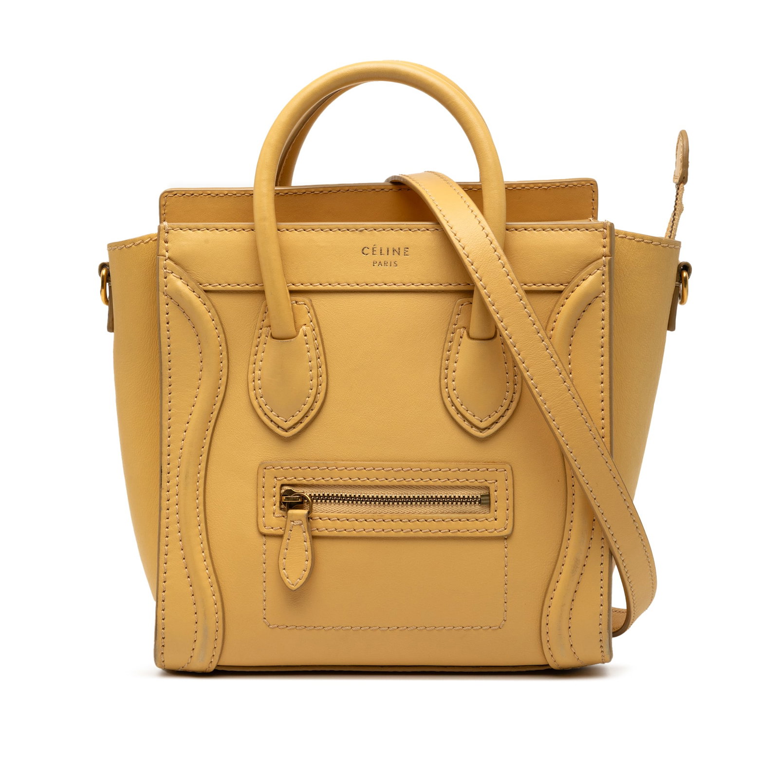 Nano Luggage Tote Bag in Yellow Leather by Celine: Nano Luggage Tote Bag in Yellow Leather by Celine This Celine Nano Leather Luggage Tote showcases a yellow leather body with rolled leather handles, a detachable flat shoulder strap, a top zip closure