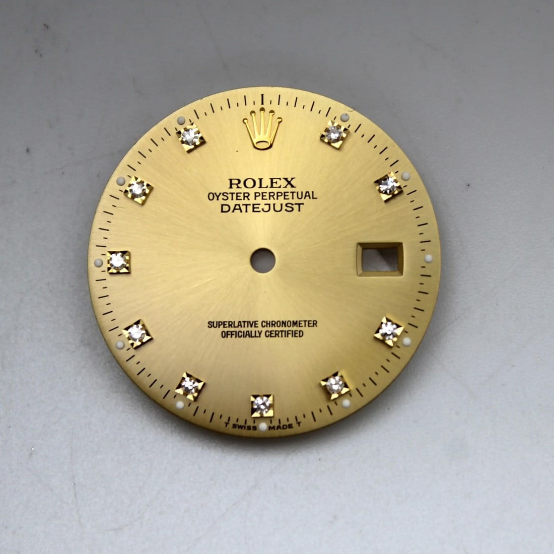 Rolex Datejust 36mm Champagne Dial with Diamond Markers: Rolex Datejust 36mm Champagne Dial with Diamond Markers This exquisite Rolex Datejust watch dial features a luxurious champagne color with diamond markers, designed for a classic and elegant appearanc