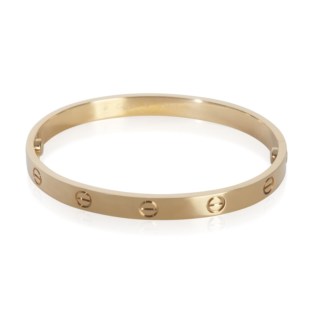 18k Yellow Gold Love Bracelet by Cartier with Box and Certificate: 18k Yellow Gold Love Bracelet by Cartier with Box and Certificate This pre-owned Cartier Love bracelet is crafted from 18k yellow gold and features a screw clasp. Part of the iconic Love collection, t