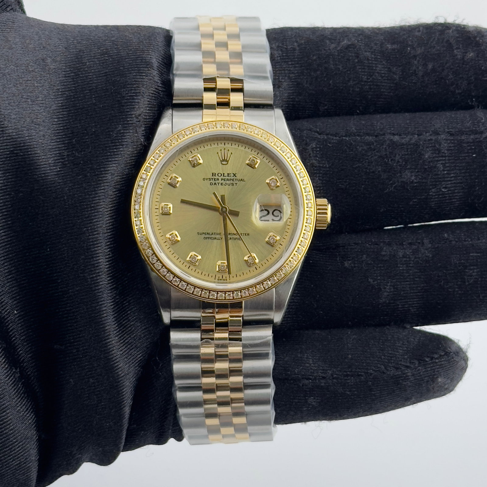 Datejust Ref 1601 Diamond Dial Watch with Aftermarket Jubilee Bracelet: Datejust Ref 1601 Diamond Dial Watch with Aftermarket Jubilee Bracelet This Rolex Datejust features a champagne diamond dial, a pave plated bezel, and an aftermarket Jubilee bracelet. It is designed f