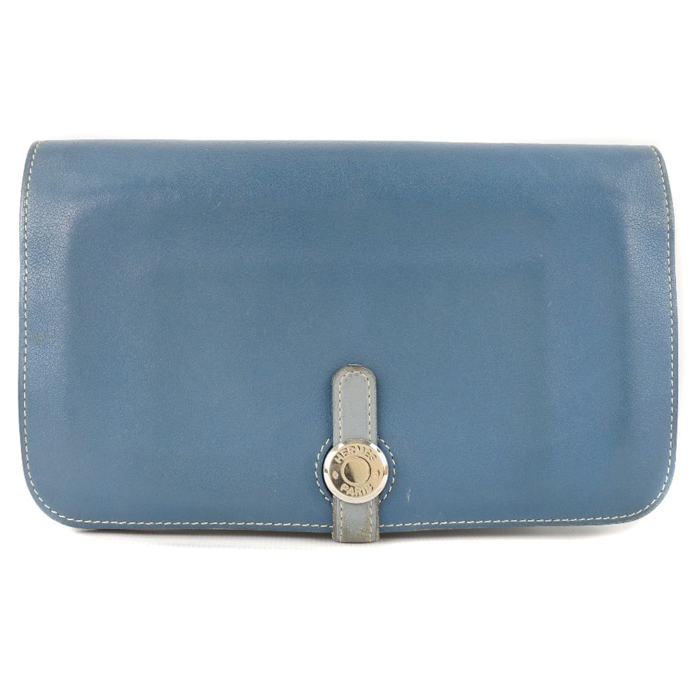 Hermes Dogon Duo Blue Calfskin Women's Wallet: Hermes Dogon Duo Blue Calfskin Women's Wallet This Hermes Dogon Duo Combined Wallet is crafted from calfskin leather in blue and is designed for women. The wallet features a spacious interior and a se