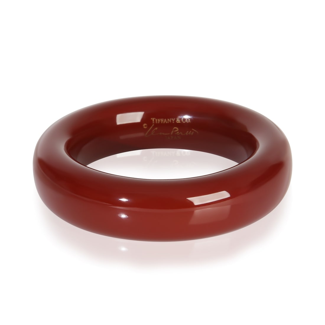 Elsa Peretti Red Lacquer 7 Inch Bracelet by Tiffany & Co.: Elsa Peretti Red Lacquer 7 Inch Bracelet by Tiffany & Co. This Tiffany & Co. Elsa Peretti Red Lacquer Bracelet is a stylish accessory from the renowned Elsa Peretti collection. Crafted without stones 