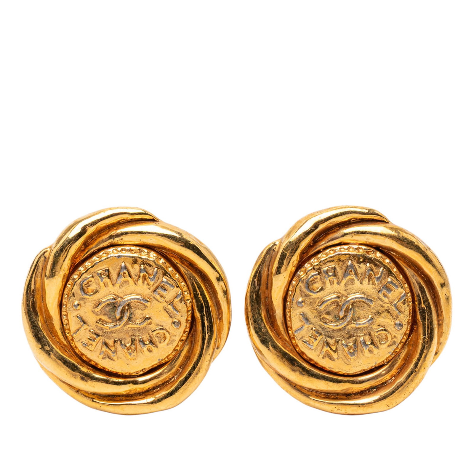 Chanel Twisted Double Logo Round Gold Tone Clip Earrings: Chanel Twisted Double Logo Round Gold Tone Clip Earrings These Chanel earrings feature a gold tone metal body with a twisted double logo round design and clip-on closures. Made in France, these costum