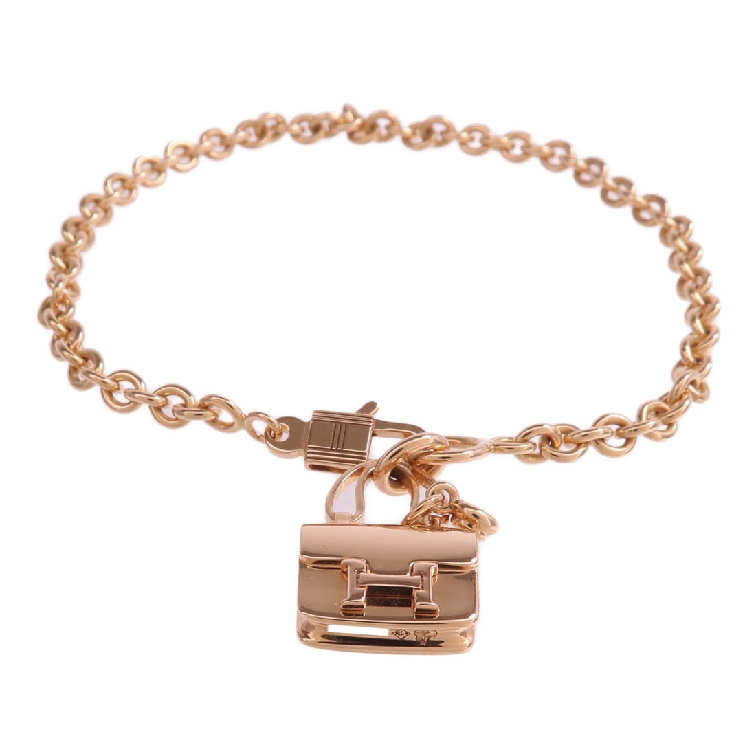 Amulettes Constance Diamond Bracelet in 18K Rose Gold by Hermes: Amulettes Constance Diamond Bracelet in 18K Rose Gold by Hermes This HERMES Amulettes Constance bracelet showcases exquisite craftsmanship in 18K pink gold and is adorned with diamonds. Designed for w