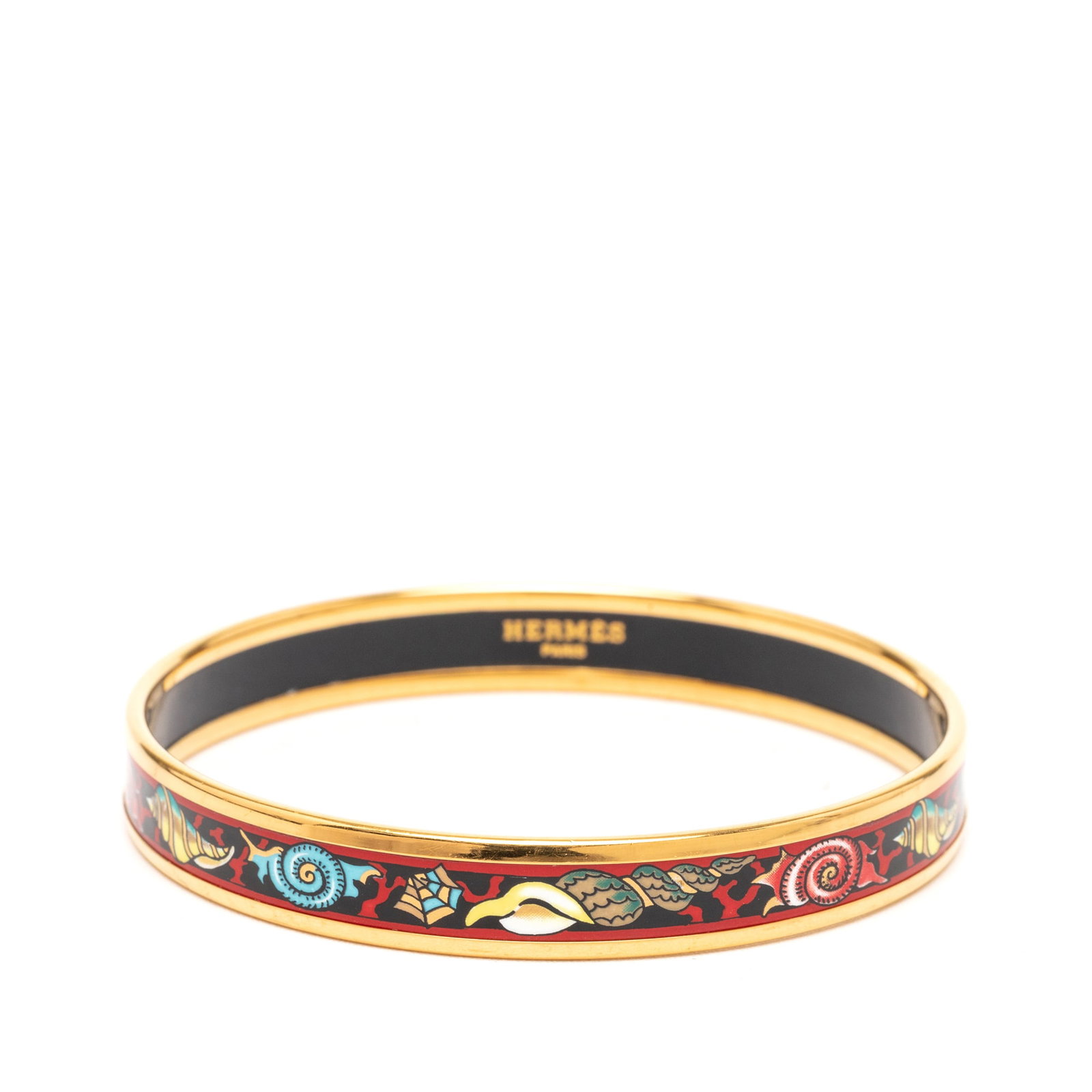 Hermes Shells Print Red Enamel Gold Plated Narrow Bangle Size 70: Hermes Shells Print Red Enamel Gold Plated Narrow Bangle Size 70 This Hermes Narrow Shells Enamel Bangle 70 features a vibrant printed motif on enamel with a gold-plated body in a red colorway. Made i