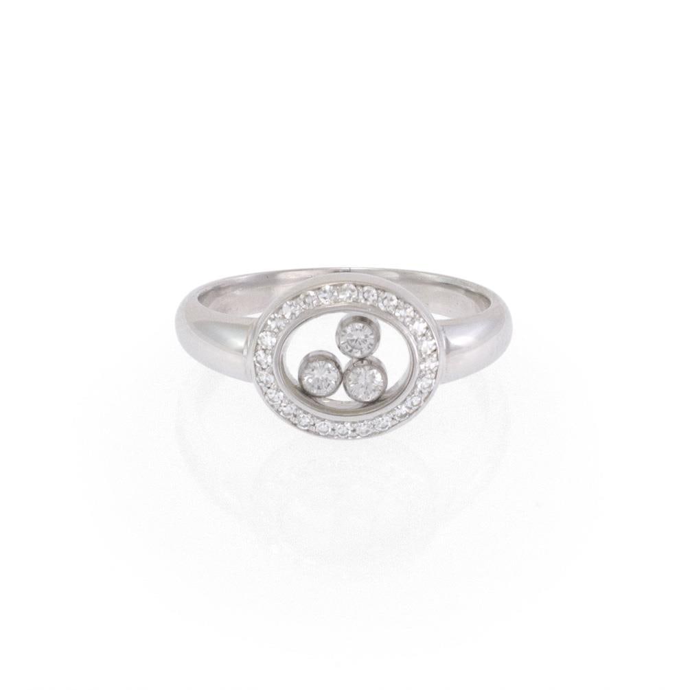 Chopard Happy Diamond 18k White Gold Ring with Floating Diamonds: Chopard Happy Diamond 18k White Gold Ring with Floating Diamonds This exquisite ring from Chopard's Happy Diamond Collection showcases a stunning oval-shaped diamond bezel. It features a double-sized 
