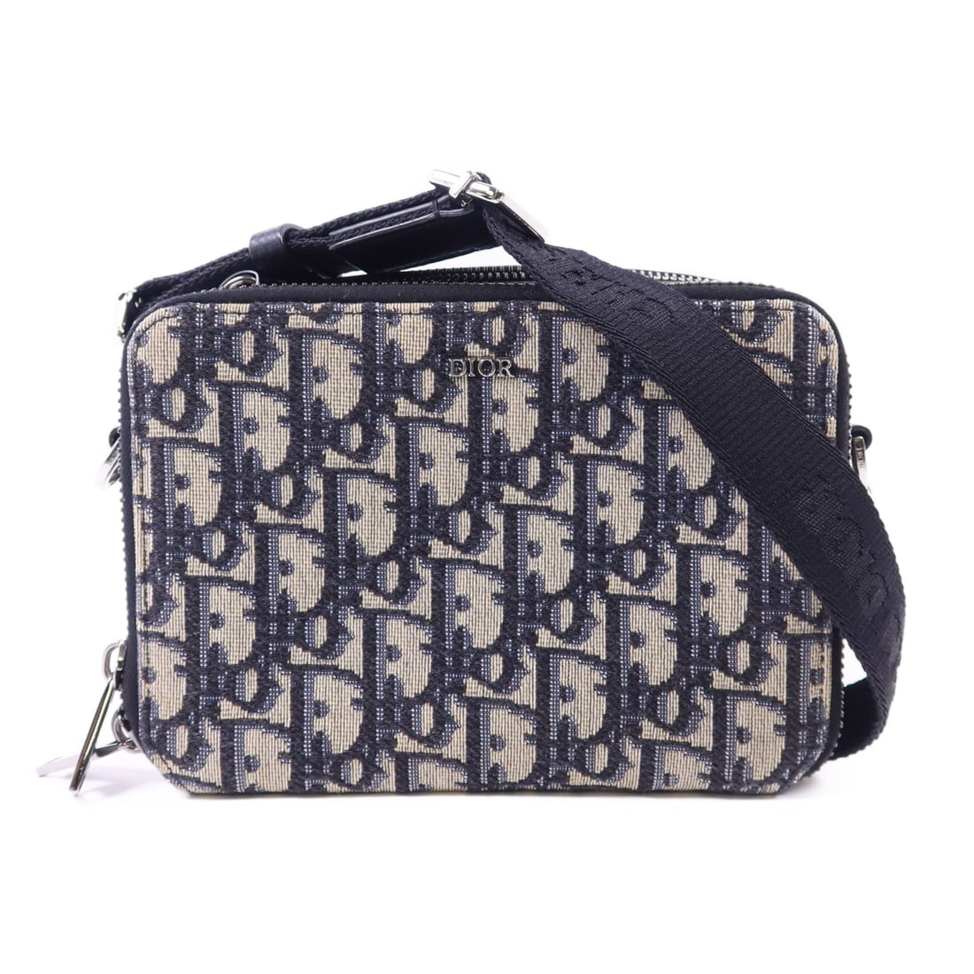 Dior Navy Canvas CD Zipped Shoulder Bag With Strap: Dior Navy Canvas CD Zipped Shoulder Bag With Strap This Christian Dior CD zipped pouch shoulder bag features a navy canvas exterior and includes a strap for versatile wear. Crafted in France, the bag 