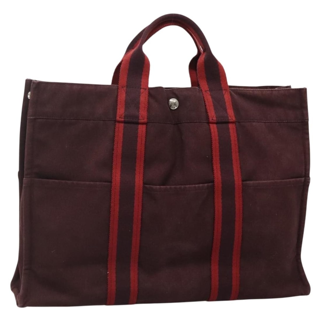 Red Canvas Fourre Tout MM Handbag by Hermes 42cm x 30cm x 10cm: Red Canvas Fourre Tout MM Handbag by Hermes 42cm x 30cm x 10cm This pre-owned Hermes Fourre Tout MM tote handbag for women features a red canvas body with leather accents. It shows signs of use includ