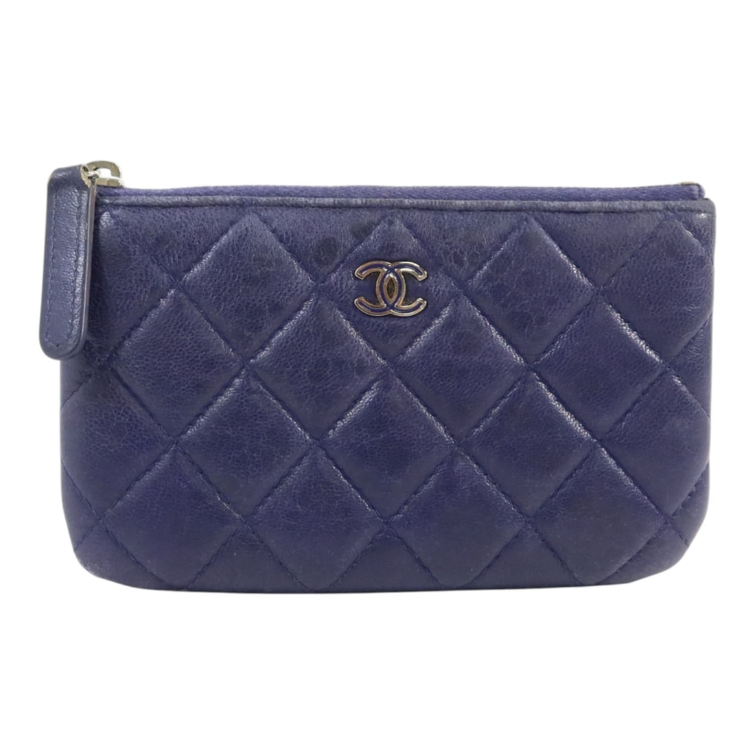 CHANEL Mini Blue Lambskin Zipped Pouch with Silver Tone CC: CHANEL Mini Blue Lambskin Zipped Pouch with Silver Tone CC This Chanel mini zipped pouch is crafted from luxurious blue lambskin leather, designed for women. It features a CC logo and silver-tone hard