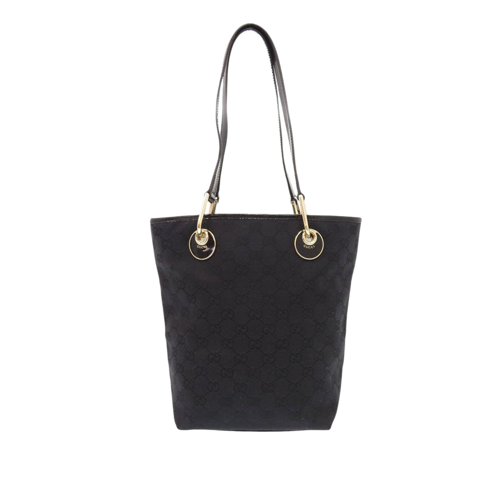 Black GG Canvas Eclipse Tote Bag by Gucci with Leather Straps: Black GG Canvas Eclipse Tote Bag by Gucci with Leather Straps This Gucci GG Canvas Eclipse Tote features a canvas body with flat leather shoulder straps, an open top, and interior zip and slip pockets