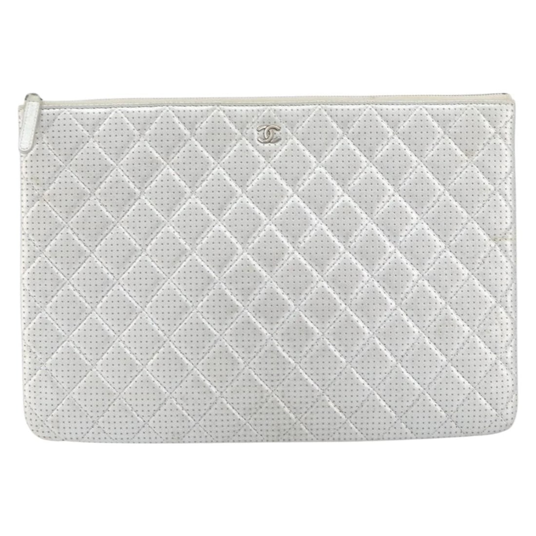 Chanel Silver Quilted Perforated Lambskin O Case Clutch Bag: Chanel Silver Quilted Perforated Lambskin O Case Clutch Bag This Chanel O Case Clutch is crafted from silver perforated lambskin leather featuring a quilted design. Designed for women, it offers a sty