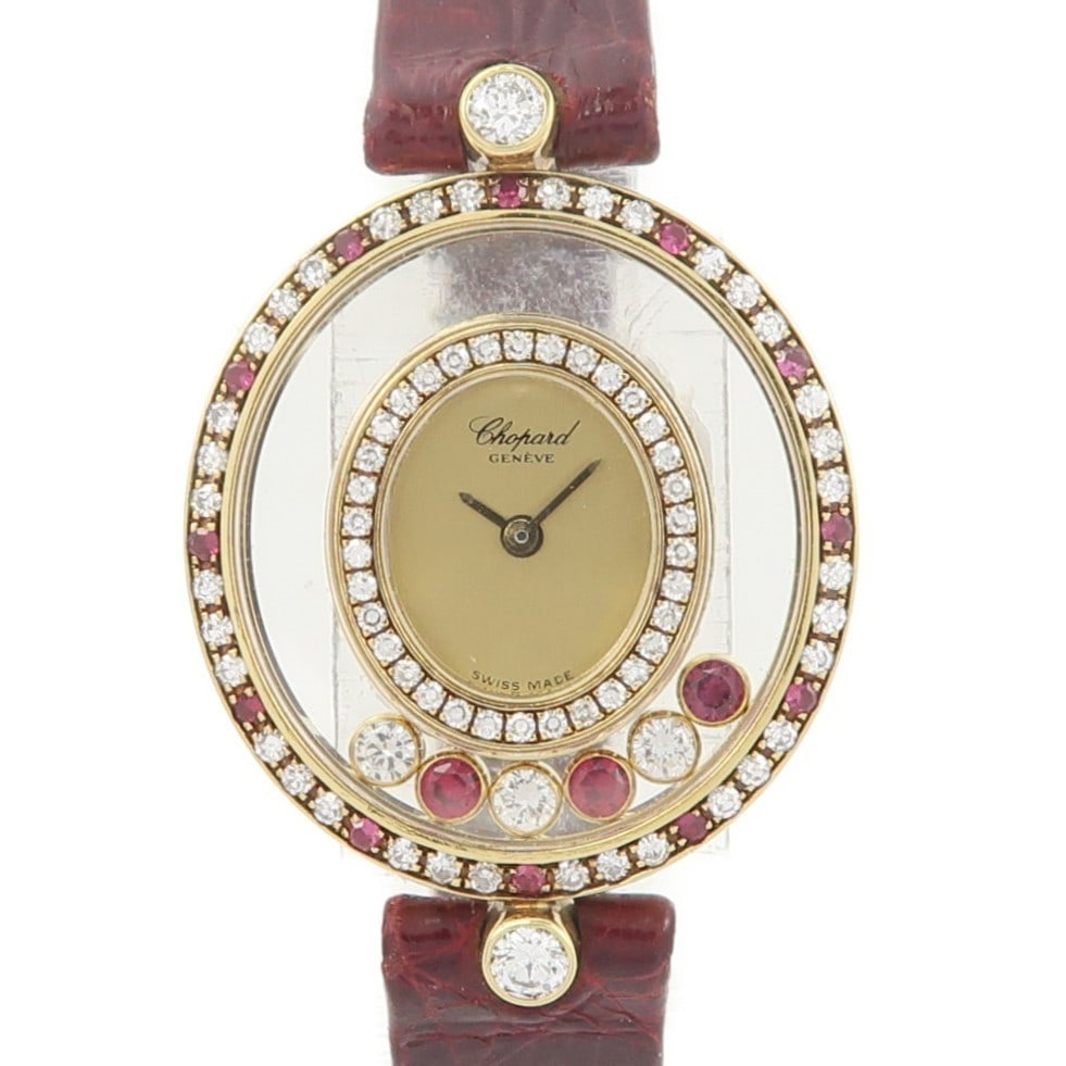 Chopard Happy Diamond Quartz 18K Yellow Gold Women's Wristwatch: Chopard Happy Diamond Quartz 18K Yellow Gold Women's Wristwatch This Chopard Happy Diamond Quartz Watch features an elegant 18K yellow gold case and band, accented with diamond and ruby details. Desig