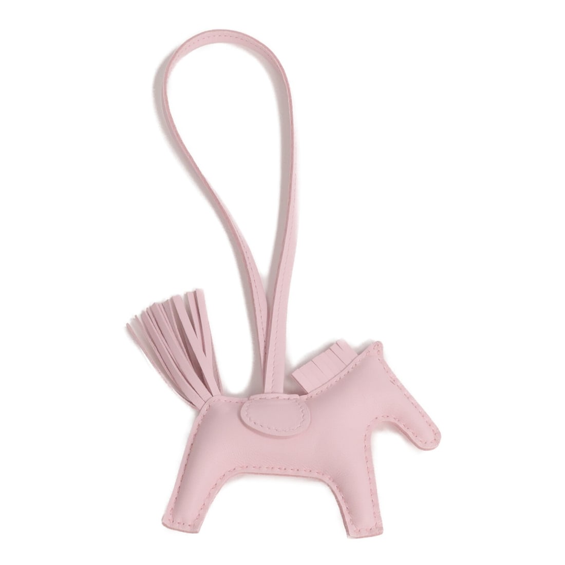 Hermes Rodeo PM Lambskin Pink Charm: Hermes Rodeo PM Lambskin Pink Charm This Hermes Rodeo PM Charm is crafted from high-quality Milo lambskin leather in a delicate mauve pink shade. Designed as a stylish accessory, it adds a playful and