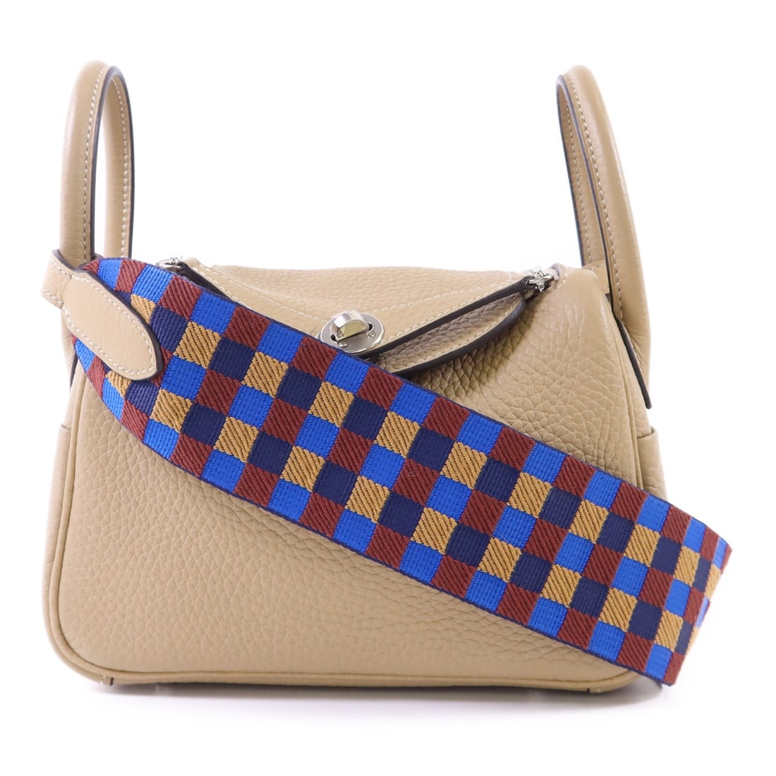Mini Lindy Beige Calfskin 2Way Shoulder Bag With Palladium Hardware: Mini Lindy Beige Calfskin 2Way Shoulder Bag With Palladium Hardware This Hermes Mini Lindy 2-way shoulder bag is crafted from durable Taurillon Clemence calfskin leather in a beige color. Designed for