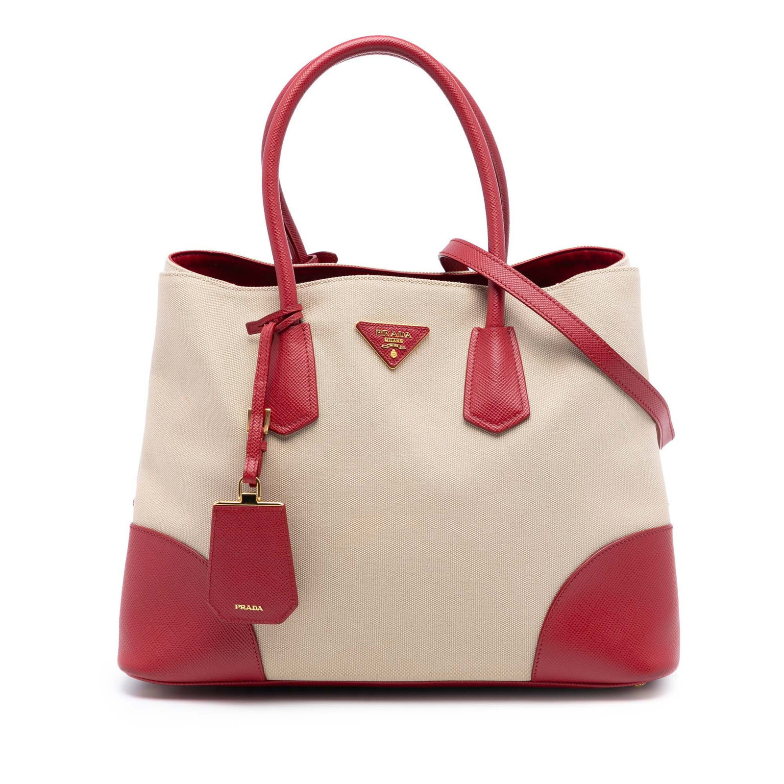 Prada Beige Canvas Satchel with Saffiano Leather Trim and Shoulder Strap: Prada Beige Canvas Satchel with Saffiano Leather Trim and Shoulder Strap This Prada Large Canapa and Saffiano Double Satchel features a beige canvas body with saffiano leather trim, rolled saffiano le