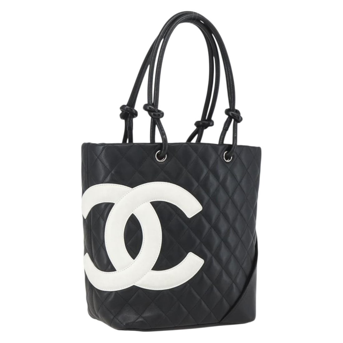 Chanel Cambon Matelasse Medium Black Leather Tote with CC Logo and Dust Bag: Chanel Cambon Matelasse Medium Black Leather Tote with CC Logo and Dust Bag This CHANEL Cambon Line Matelasse Medium Tote Bag features a black leather exterior with silver-tone accents. Made in Italy,