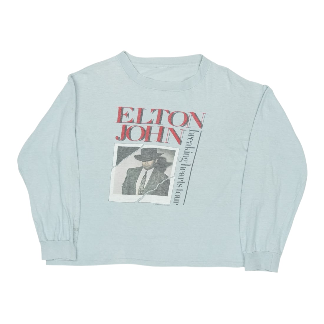 Vintage 1988 Elton John Breaking Hearts Concert Tour Gray Cotton Shirt: Vintage 1988 Elton John Breaking Hearts Concert Tour Gray Cotton Shirt This is an original vintage 1988 Elton John Breaking Hearts Tour shirt featuring front and back graphics. Made from 100% cotton, 