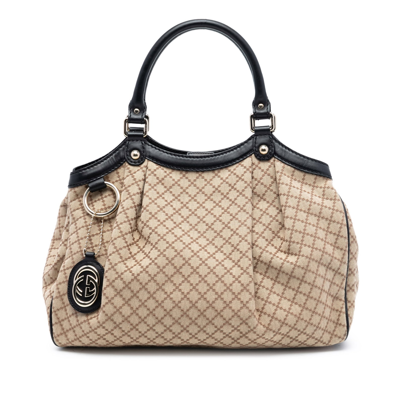 Gucci Sukey Beige Canvas Tote with Leather Trim Medium Size: Gucci Sukey Beige Canvas Tote with Leather Trim Medium Size This Gucci Medium Diamante Canvas Sukey Tote features a beige canvas body with leather trim, rolled leather handles, and an open top secured