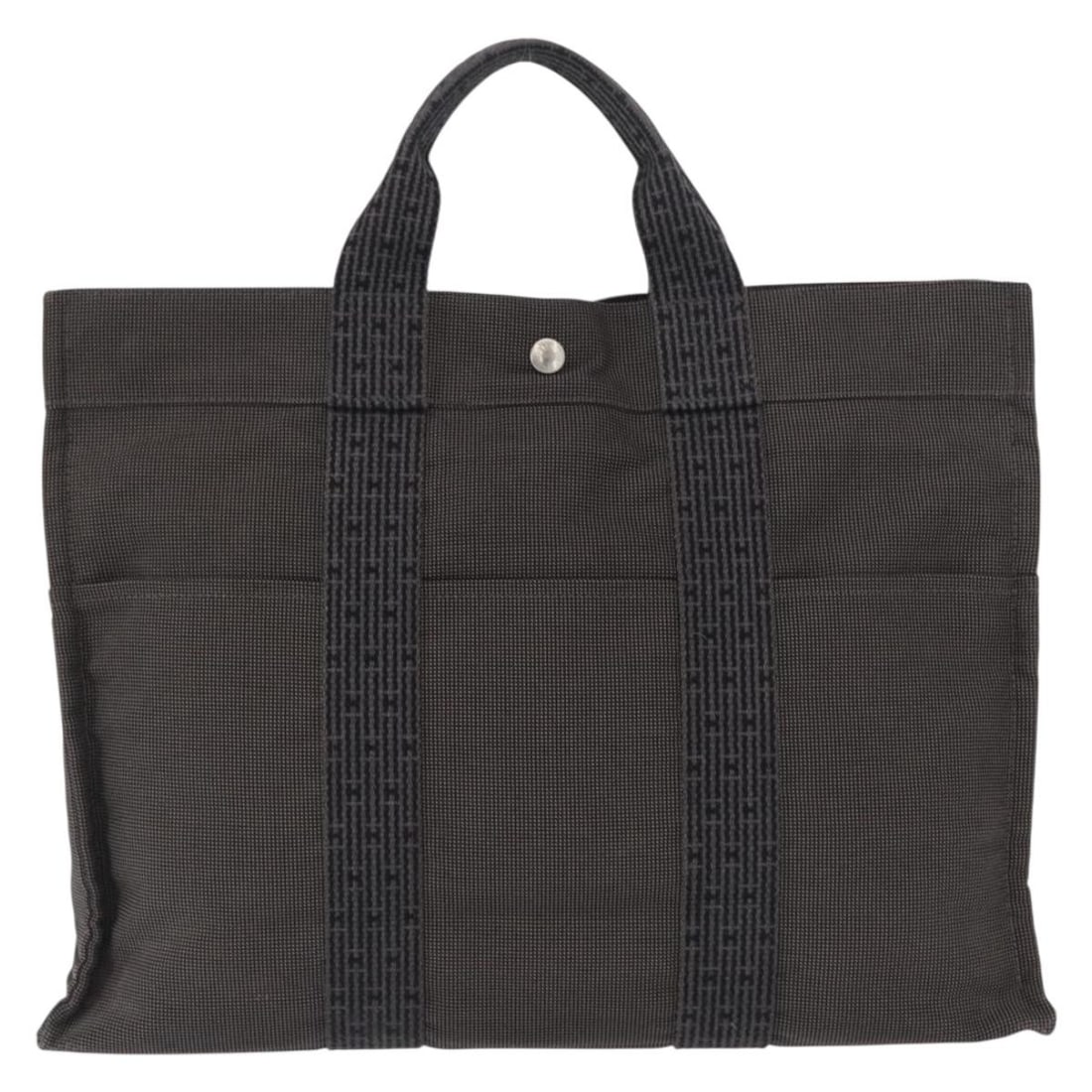 Hermes Herline Canvas Tote Bag Gray 43cm by 30cm by 10cm: Hermes Herline Canvas Tote Bag Gray 43cm by 30cm by 10cm The Hermes Fourre-tout Herline is a women's tote bag crafted from gray canvas. It features metal fittings and an interior pocket. The bag shows