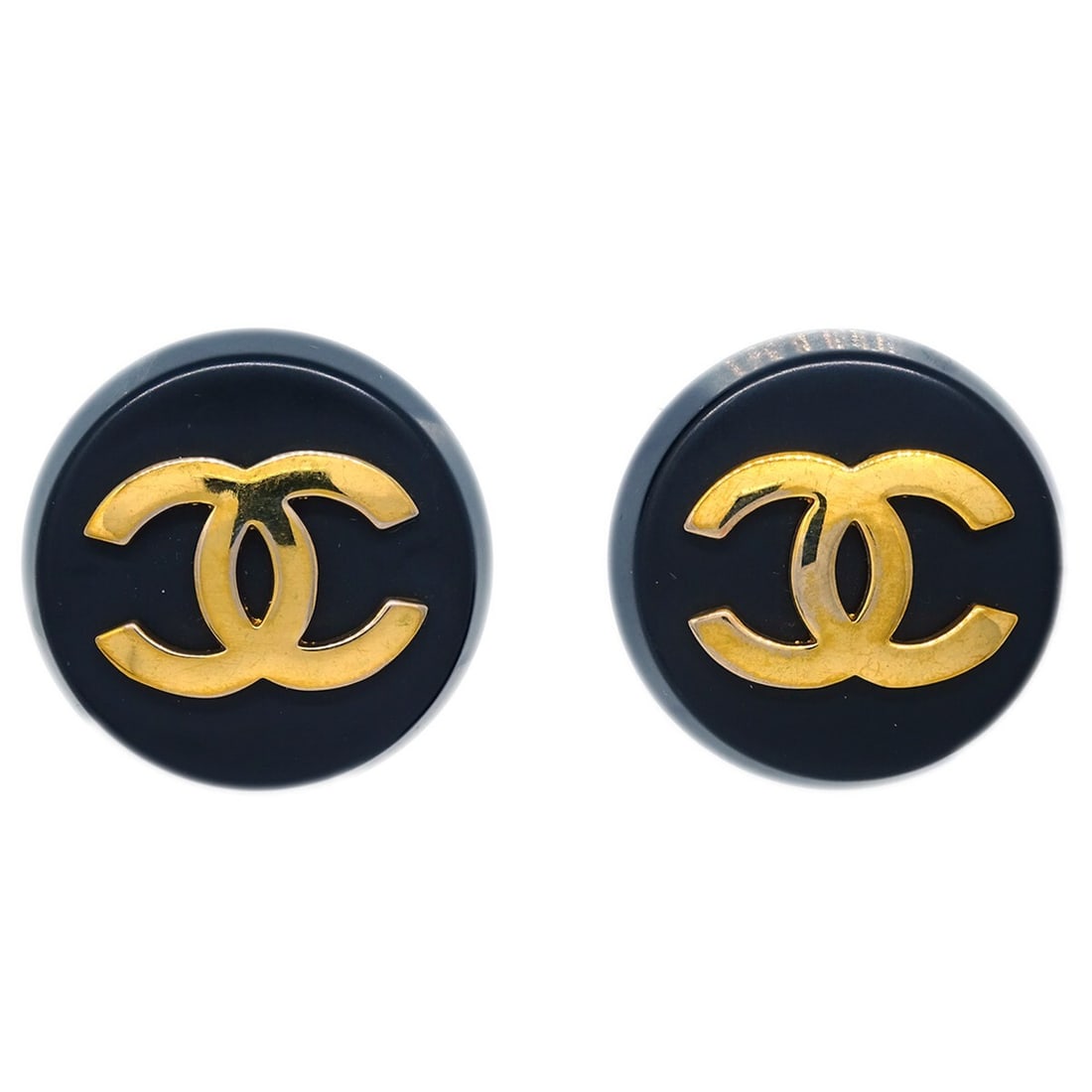 Clip-On Round Earrings Gold-Plated Black Button Style by Chanel: Clip-On Round Earrings Gold-Plated Black Button Style by Chanel These Chanel button earrings feature a classic round shape with a black and gold color scheme. Crafted from gold-plated material, they a