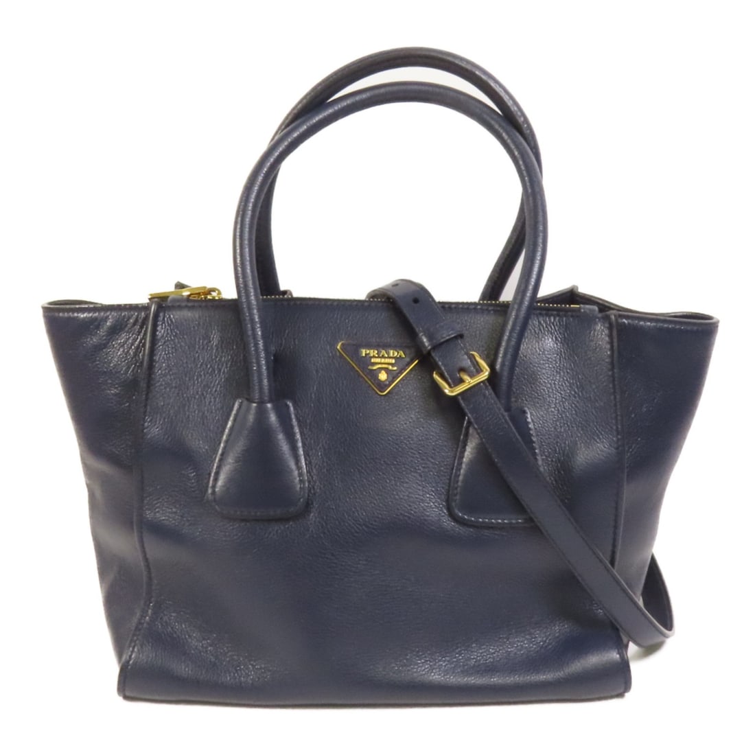 Blue Calfskin PRADA Shoulder Bag with Gold Hardware Two-Way Design: Blue Calfskin PRADA Shoulder Bag with Gold Hardware Two-Way Design This Prada 2-way shoulder bag is crafted from blue calfskin leather and features gold-tone hardware. Made in Italy, it offers versati