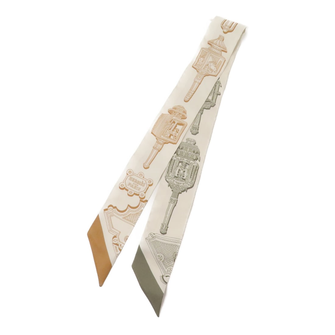 Hermes Twilly silk brown green neck scarf: Hermes Twilly silk brown green neck scarf This Hermes Twilly scarf is crafted from luxurious silk and features a sophisticated brown and green color palette. Designed for women, this elegant accessory