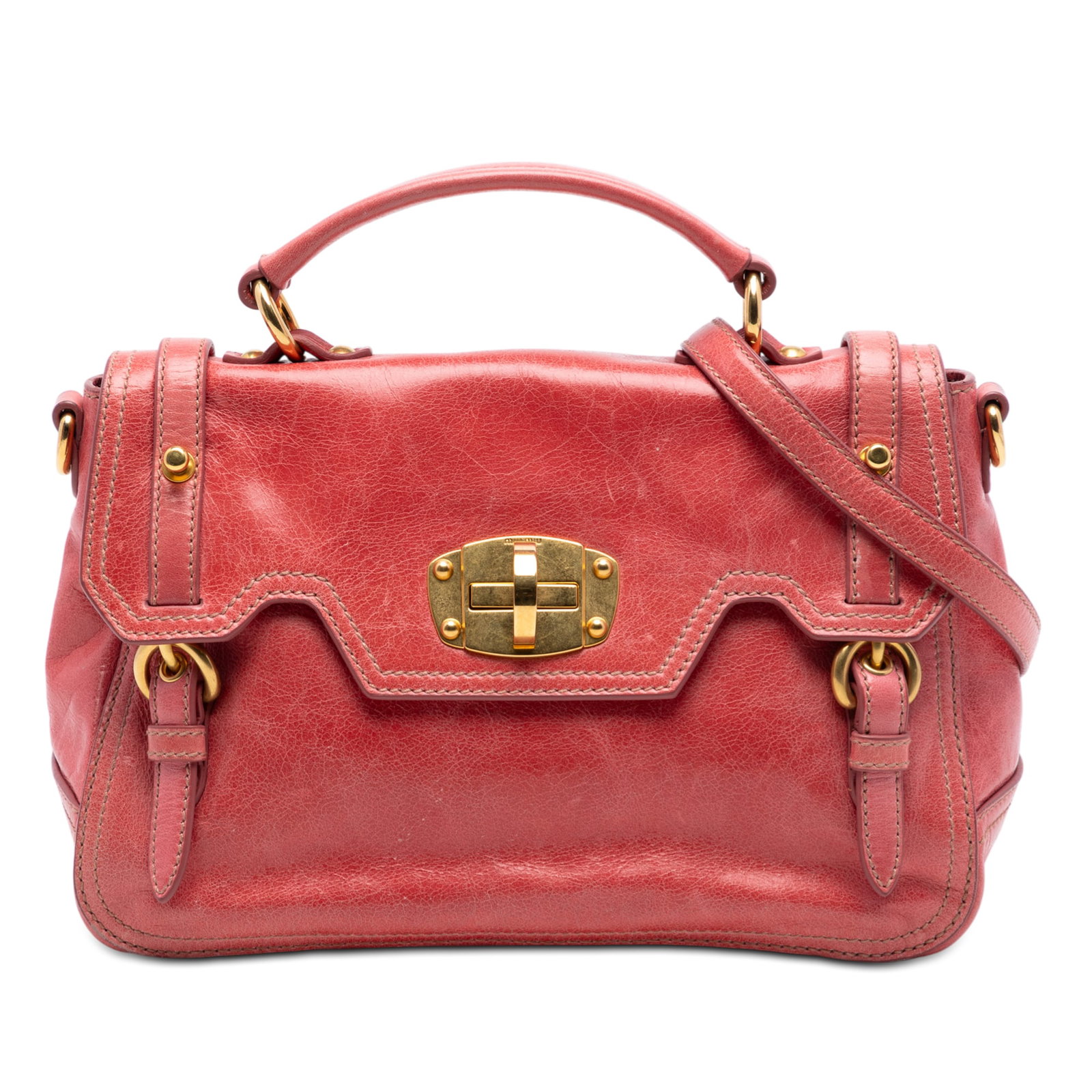 Pink Leather Satchel with Turnlock Closure by Miu Miu: Pink Leather Satchel with Turnlock Closure by Miu Miu This Miu Miu satchel is crafted from distressed pink leather and features a flat leather top handle, a detachable flat leather strap, and a front 