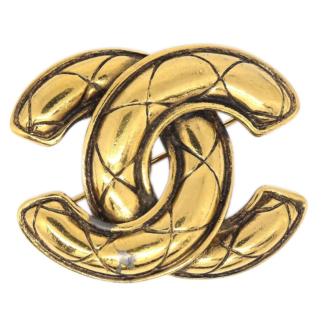 Medium Gold Plated Brooch with CC Logo by Chanel: Medium Gold Plated Brooch with CC Logo by Chanel This Chanel brooch features a quilted CC logo design in a medium size, crafted from gold-plated metal. It showcases the iconic brand logo and is finish