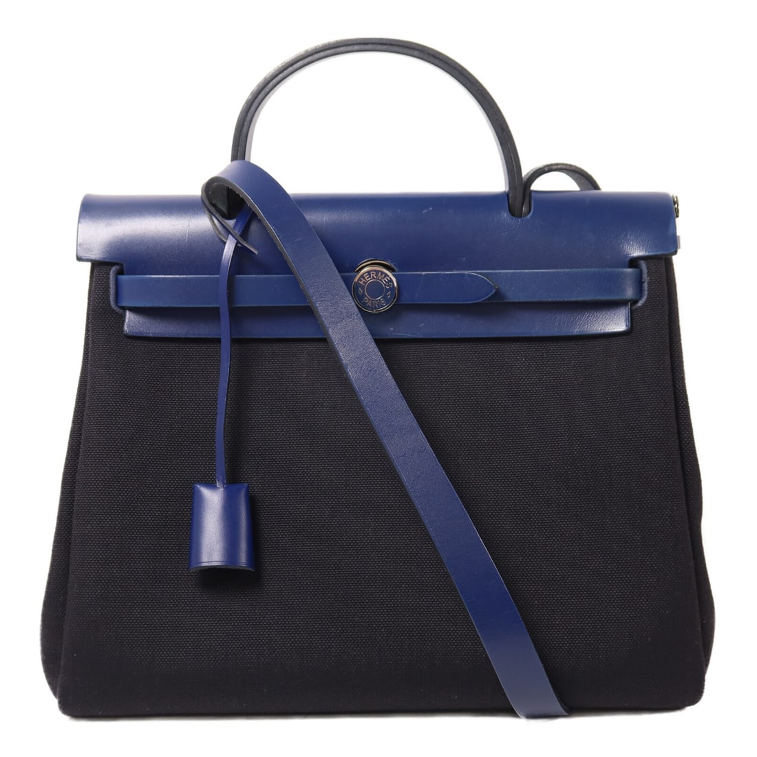 Hermes Herbag PM canvas 2 way shoulder bag black: Hermes Herbag PM canvas 2 way shoulder bag black This Hermes Herbag PM is a versatile 2-way shoulder bag crafted from durable black canvas. Designed for women, it features a classic silhouette with a 
