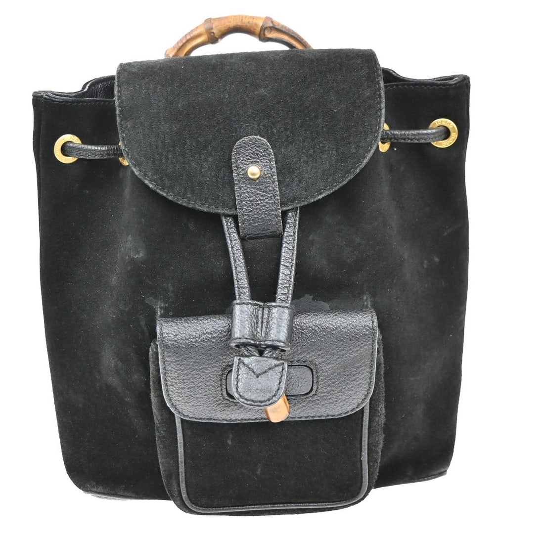 Black Suede Gucci Bamboo Vintage Backpack Purse 20cm x 23cm: Black Suede Gucci Bamboo Vintage Backpack Purse 20cm x 23cm This Gucci vintage bamboo backpack features a black suede exterior and is designed for women. It showcases the iconic bamboo detailing and o