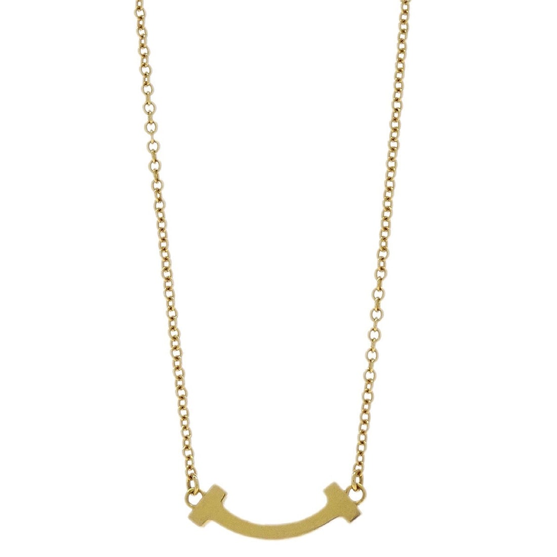 Gold T Smile Mini Pendant Necklace by Tiffany & Co. Au750: Gold T Smile Mini Pendant Necklace by Tiffany & Co. Au750 This Tiffany & Co. T Smile Mini Pendant Necklace features a minimalist charm design crafted in 18k gold. The necklace does not include a main 